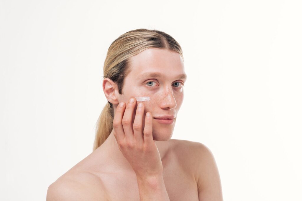 model applying face cream